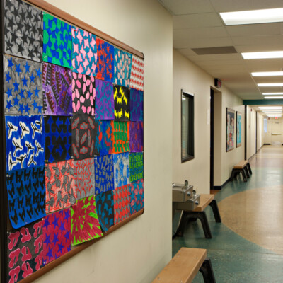 a colorful charter school facility hallway decorated with student art