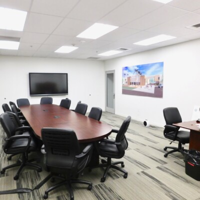 Administrative office with two large desks and black chairs