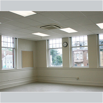 Charter school classroom with white walls and lots of windows