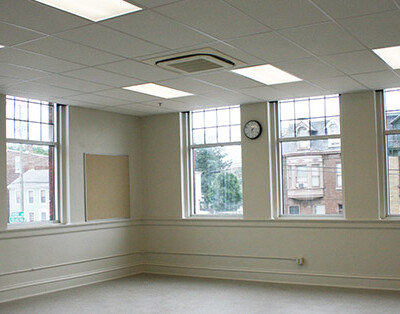 Charter school classroom with white walls and lots of windows