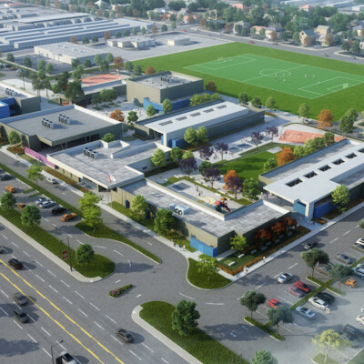 Full aerial view of the future campus for Norton Science and Language Academy showing 7 school buildings a football field and multiple parking lots