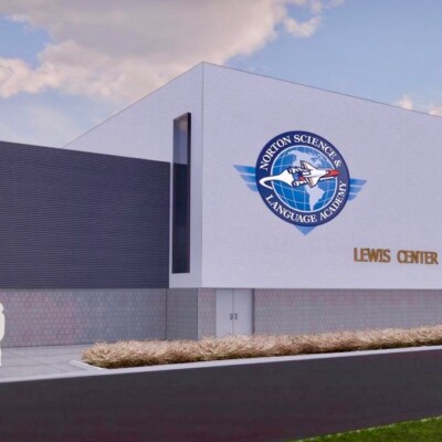 Modern building with a space-themed logo and the text 'Lions Gaming'.