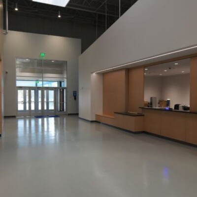 A hallway with an information desk located in Young Audiences new school building